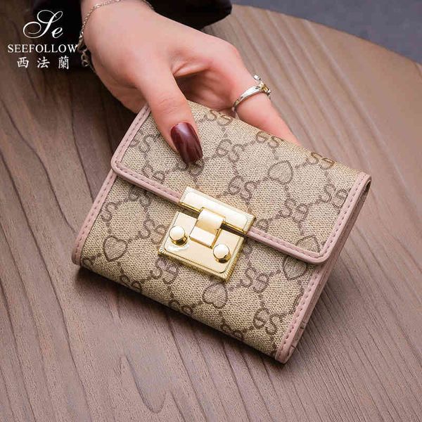 bag handbag 2021 wallet women's short leather folding multi-function buckle printing card versatile fashion, Black;red
bag handbag 2021 wallet women's short leather folding multi-function buckle printing card versatile fashion, Black;red