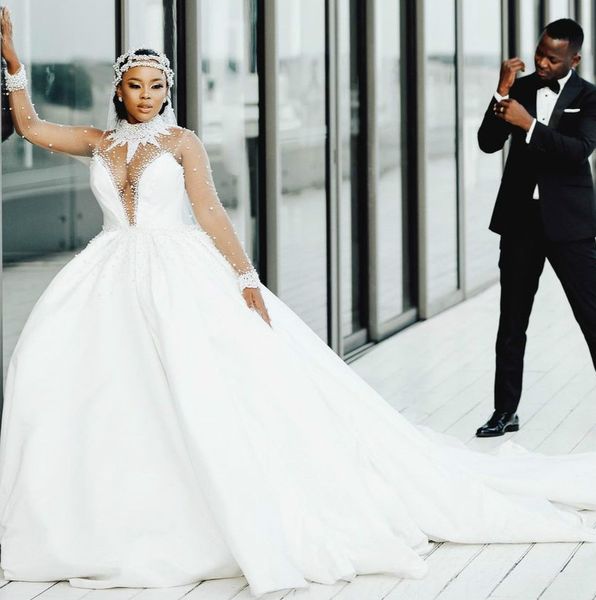 2021 plus size arabic aso ebi luxurious sheer neck wedding dresses pearls long sleeves bridal dresses wedding gowns zj406, White
2021 plus size arabic aso ebi luxurious sheer neck wedding dresses pearls long sleeves bridal dresses wedding gowns zj406, White