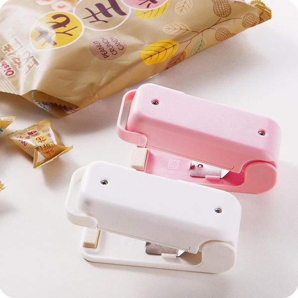 bag clips pink mini sealing machine plastic heat lid kitchen storage packaging clip 
bag clips pink mini sealing machine plastic heat lid kitchen storage packaging clip