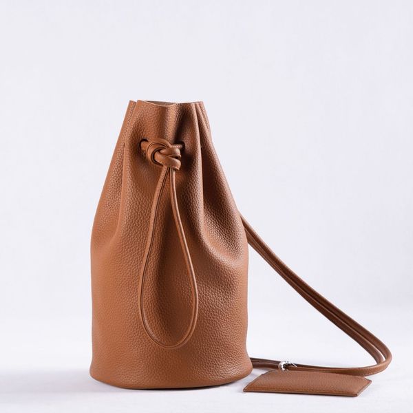 south korea's women's bag niche design head leather messenger simple drawstring single shoulder bucket bag, Black;red
south korea's women's bag niche design head leather messenger simple drawstring single shoulder bucket bag, Black;red
