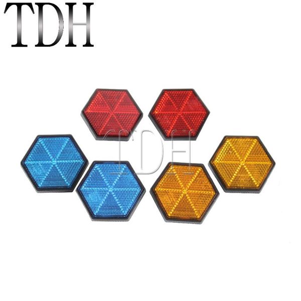 motorcycle mirrors red yellow blue hexagonal reflector with mounting screw on back
motorcycle mirrors red yellow blue hexagonal reflector with mounting screw on back