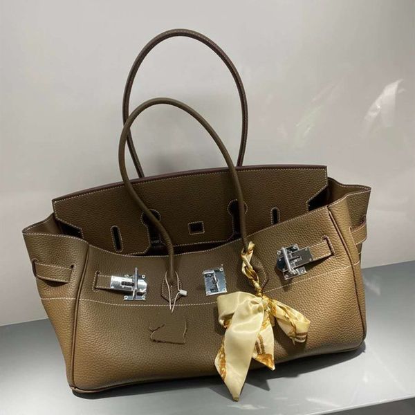 design purse new and winter cowhide women's bag layer long litchi pattern large 40cm
design purse new and winter cowhide women's bag layer long litchi pattern large 40cm