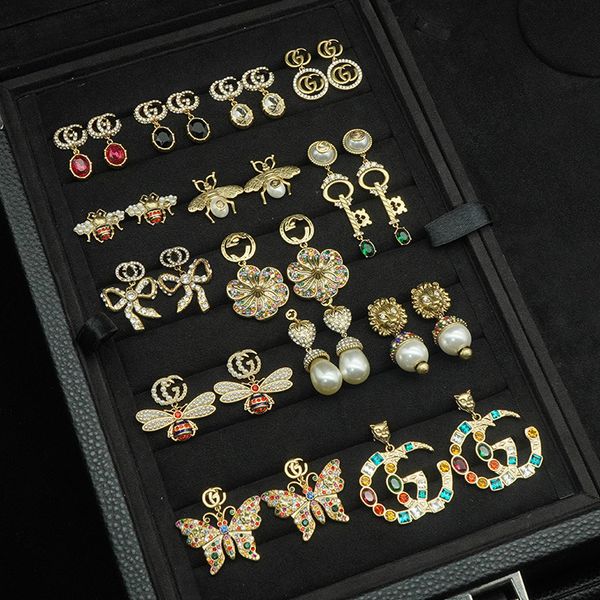 g ancient tiger head pearl bee double g earrings female brass net red star same style, Black
g ancient tiger head pearl bee double g earrings female brass net red star same style, Black