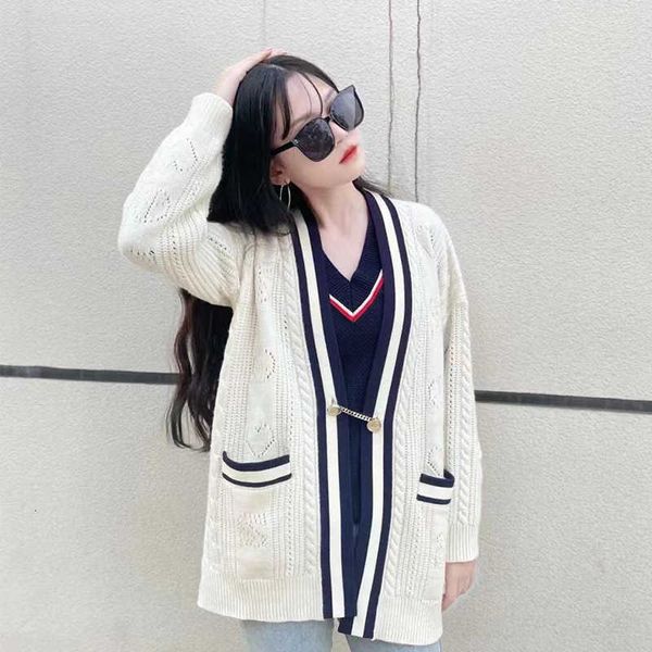 2021 french trend net red same correct version autumn winter neck loose black and white stripe knitted cardigan coat women
2021 french trend net red same correct version autumn winter neck loose black and white stripe knitted cardigan coat women