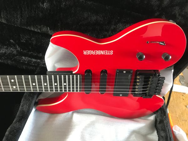 custom gloss red headless electric guitar china emg pickup, tremolo bridge & whammy bar, black hardware
custom gloss red headless electric guitar china emg pickup, tremolo bridge & whammy bar, black hardware