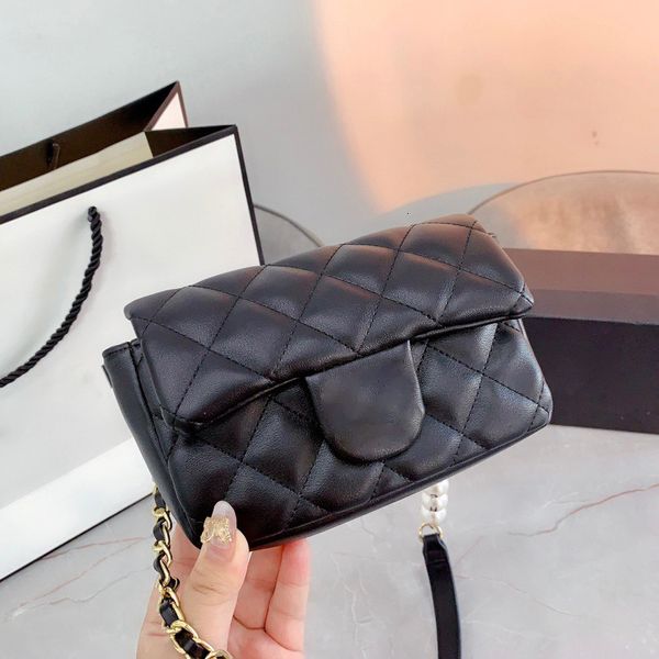 handbag 2021 spring and summer women's bag black small golden ball mini box lingge chain messenger square fat man
handbag 2021 spring and summer women's bag black small golden ball mini box lingge chain messenger square fat man