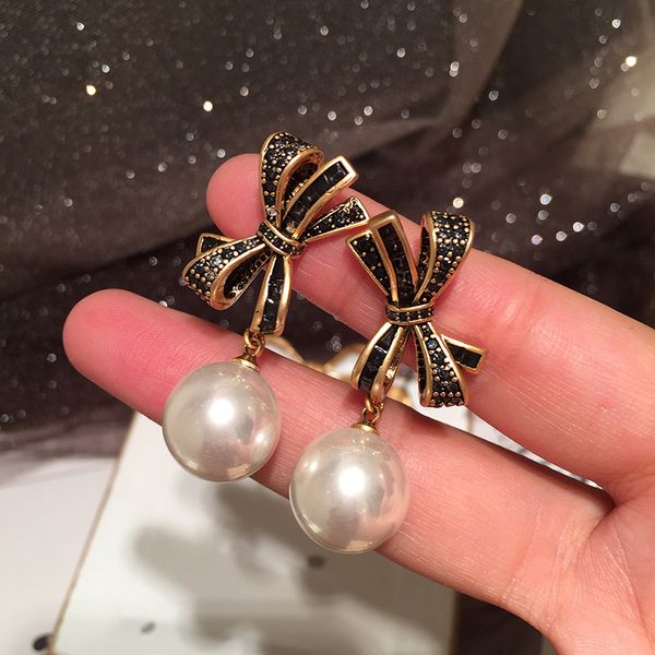 lovely cute vintage knot bow earrings new fashion pearl pendant stud earrings for woman girls students s925 silver post, Golden;silver
lovely cute vintage knot bow earrings new fashion pearl pendant stud earrings for woman girls students s925 silver post, Golden;silver