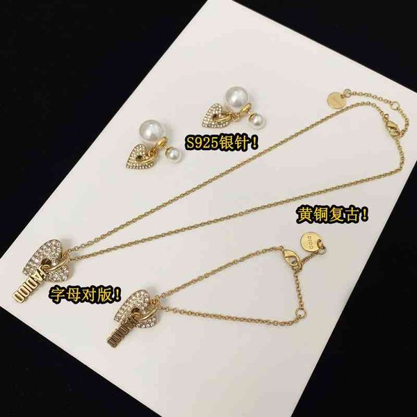 2022 factory wholesale new love pearl earrings female brass heart pendant letter bracelet necklace set, Golden
2022 factory wholesale new love pearl earrings female brass heart pendant letter bracelet necklace set, Golden