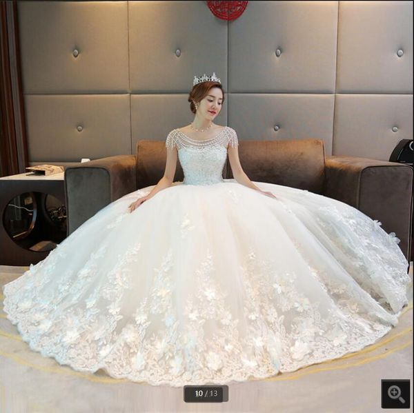 2021 robe de mariage white tulle ball gown wedding dress heavily beading pearls cap sleeve princess puffy bridal gowns lace appliques with f
2021 robe de mariage white tulle ball gown wedding dress heavily beading pearls cap sleeve princess puffy bridal gowns lace appliques with f