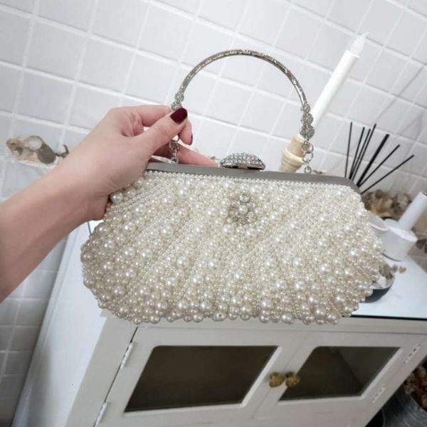 fashion2019 new banquet pearl cheongsam hi mother-in-law celebrity handbag holding bride bag slanting across
fashion2019 new banquet pearl cheongsam hi mother-in-law celebrity handbag holding bride bag slanting across