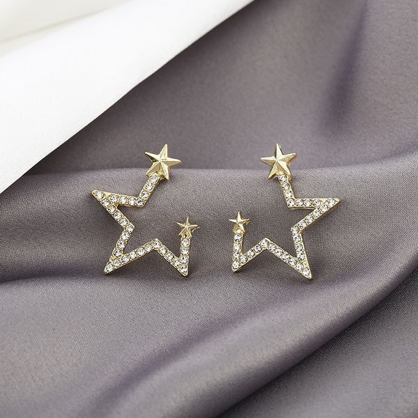 925 silver needle inlaid diamond notched star new trend simple temperament versatile net red earrings
925 silver needle inlaid diamond notched star new trend simple temperament versatile net red earrings