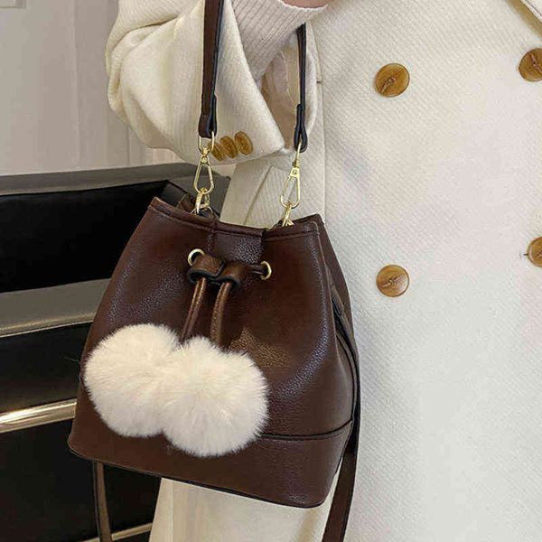 string soft pu leather quilted crossbody bucket bags for women fur ball decoration ladies shoulder handbag luxury purses
string soft pu leather quilted crossbody bucket bags for women fur ball decoration ladies shoulder handbag luxury purses