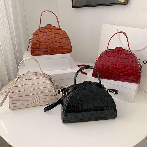 net red shell 2021 new korean fashion semi round handbag single shoulder messenger bag
net red shell 2021 new korean fashion semi round handbag single shoulder messenger bag
