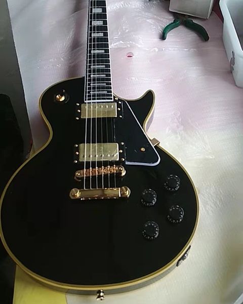 china oem customized black guitar with yellow binding, ebony fretboard electric guitar
china oem customized black guitar with yellow binding, ebony fretboard electric guitar