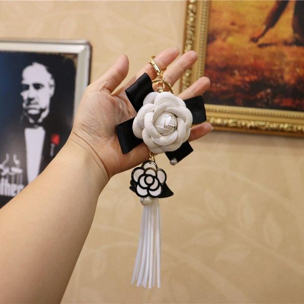 keychains black white pu leather camellia flower keychain long tassel key ring pearl charm elegant bag pendant jewelry for women, Silver
keychains black white pu leather camellia flower keychain long tassel key ring pearl charm elegant bag pendant jewelry for women, Silver