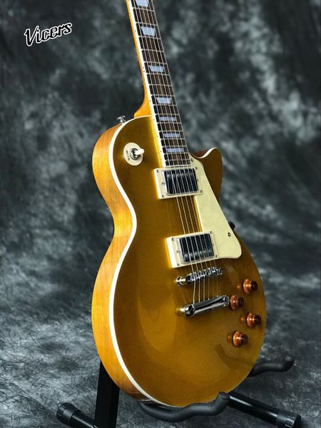 custom shop.gold electric guitar with chrome hardware.mahogany body standard musical instruments.
custom shop.gold electric guitar with chrome hardware.mahogany body standard musical instruments.