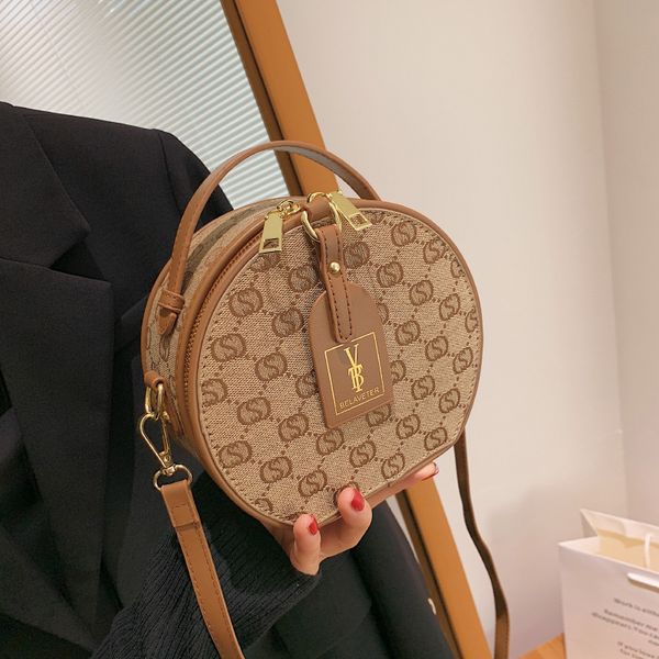 popular small bag female simple new fashion single shoulder messenger bag portable round cake outlets