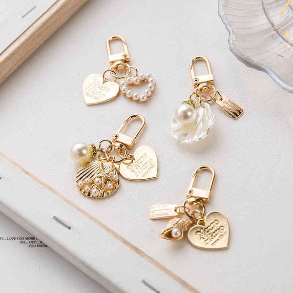 chunou cute love letter shell conch pearl keychain girl bag accessories charm car keyring gold-color gift for lover trinket new, Silver
chunou cute love letter shell conch pearl keychain girl bag accessories charm car keyring gold-color gift for lover trinket new, Silver