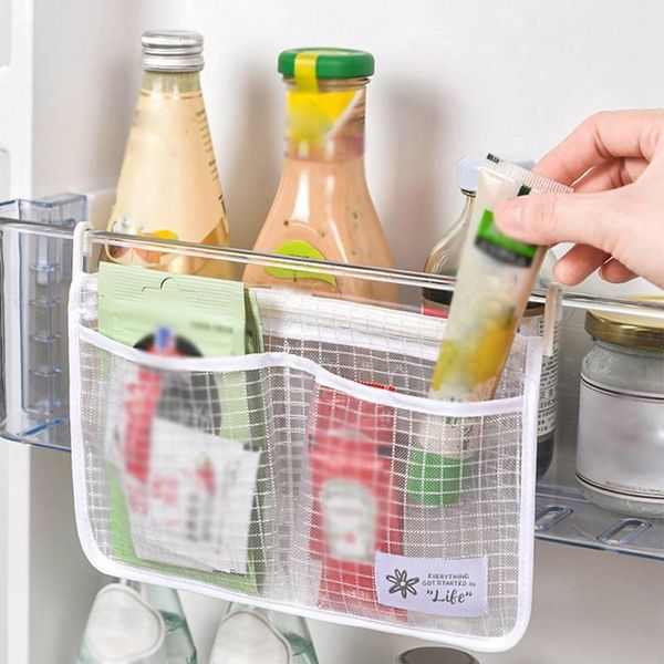 storage bags refrigerator mesh bag household kitchen hanging classification double compartment 
storage bags refrigerator mesh bag household kitchen hanging classification double compartment