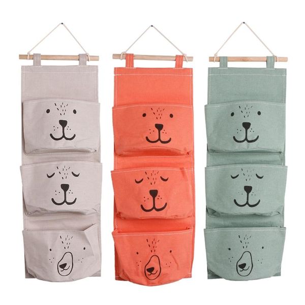 multi storey linen hanging bag waterproof 3 pockets cartoon face storage bags
multi storey linen hanging bag waterproof 3 pockets cartoon face storage bags