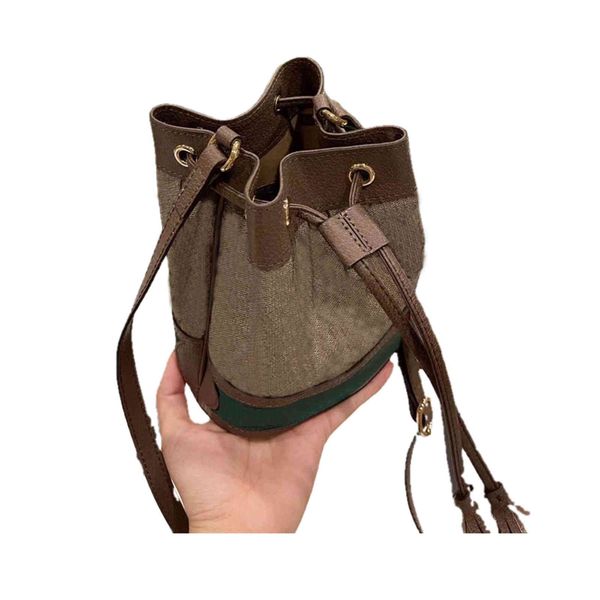 550620 designer mini bucket bag 22x17cm coffee original ebony canvas leather imitation chain bags inside can be single shoulder messenger ba
550620 designer mini bucket bag 22x17cm coffee original ebony canvas leather imitation chain bags inside can be single shoulder messenger ba