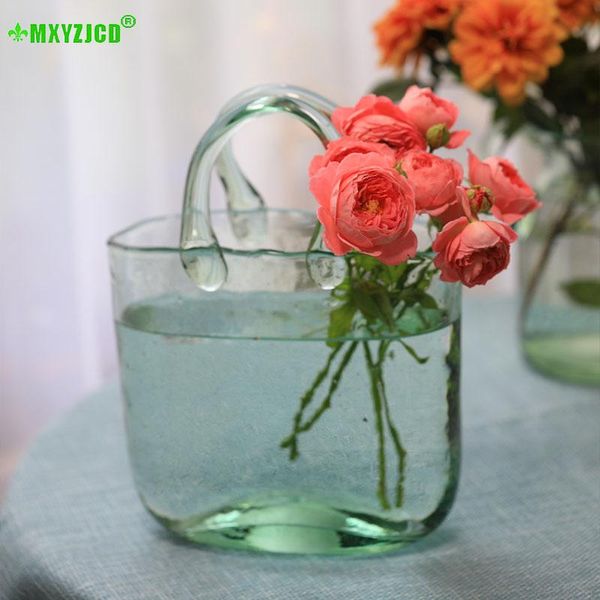 bubble light green glass basket handbag shaped vase fruit plate living room decoration accessories crafts ornaments vases 
bubble light green glass basket handbag shaped vase fruit plate living room decoration accessories crafts ornaments vases