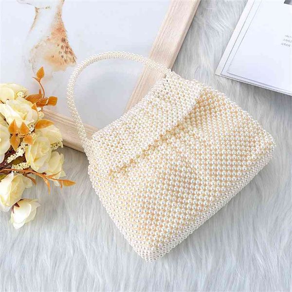 new hand woven holiday bride dinner clamshell pearl bag, handbag 
new hand woven holiday bride dinner clamshell pearl bag, handbag