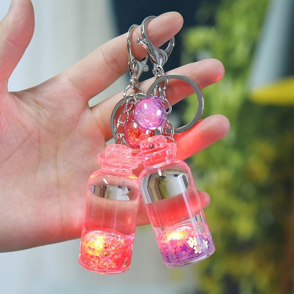 acrylic milk with light luminous liquid pendant key chain quicksand floating bottle into oil bag pendanta1, Silver
acrylic milk with light luminous liquid pendant key chain quicksand floating bottle into oil bag pendanta1, Silver