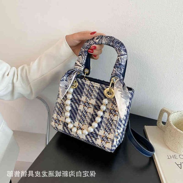 new summer 2021 hand female fashion net red check single shoulder pearl messenger princess bag
new summer 2021 hand female fashion net red check single shoulder pearl messenger princess bag