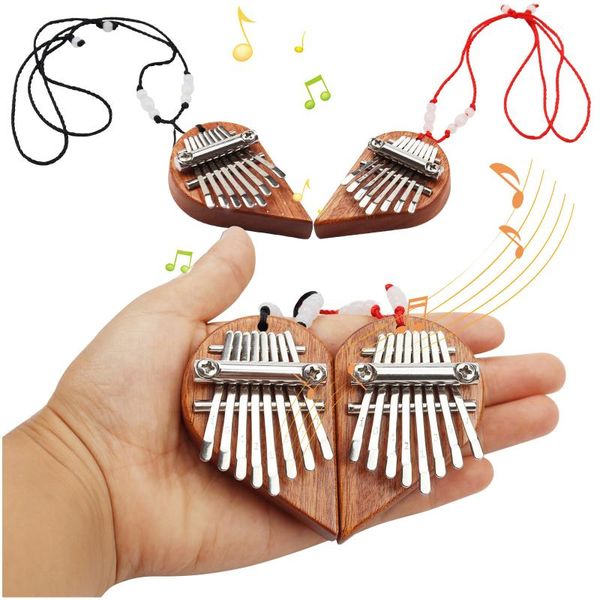 party favor mini thumb piano finger with 8 keys wood half heart portable pendant christmas gift for kids couples navidad z40
party favor mini thumb piano finger with 8 keys wood half heart portable pendant christmas gift for kids couples navidad z40