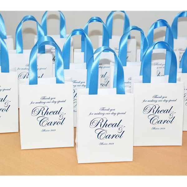 gift wrap personalized navy blue wedding welcome bags with satin ribbon and your names. elegant for small guests
gift wrap personalized navy blue wedding welcome bags with satin ribbon and your names. elegant for small guests