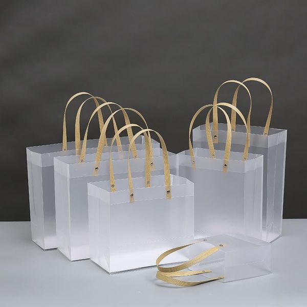 10pcs high-quality semi transparent plastic bag with paper handle frosted pp gift bags wrapping flower package wrap
10pcs high-quality semi transparent plastic bag with paper handle frosted pp gift bags wrapping flower package wrap