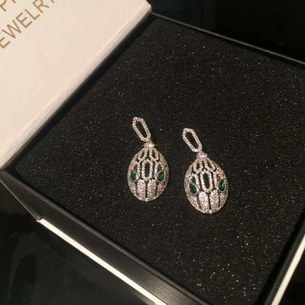 vintage hollow green eyes snake head individual elegant women earring serpent luxurious animals classic ear jewelry dangle & chandelier, Silver 
vintage hollow green eyes snake head individual elegant women earring serpent luxurious animals classic ear jewelry dangle & chandelier, Silver