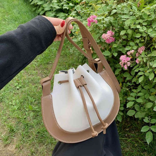 designer bags 2021 summer new korean color contrast splicing pu design semi-circular single shoulder messenger bag for women
designer bags 2021 summer new korean color contrast splicing pu design semi-circular single shoulder messenger bag for women