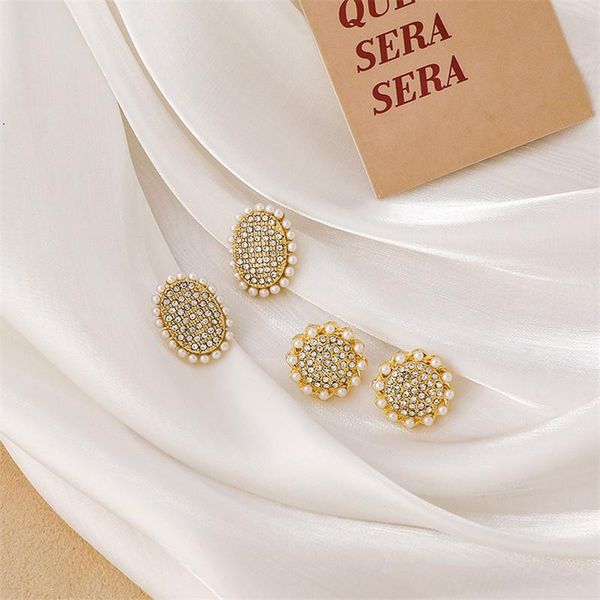 korean simple round simulated pearl rhinestone stud earrings for women fashion jewelry party gift oorbellen, Golden;silver
korean simple round simulated pearl rhinestone stud earrings for women fashion jewelry party gift oorbellen, Golden;silver
