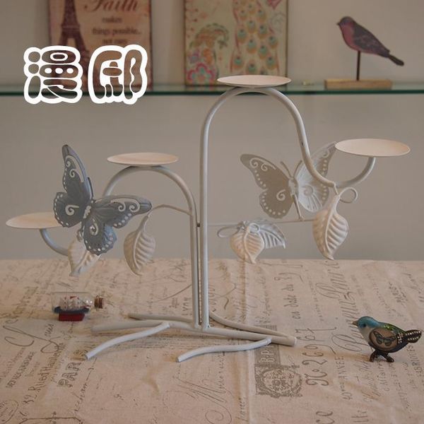 style tieyi ornaments home furnishing candle personality butterfly and flower blue white candlestick holders
style tieyi ornaments home furnishing candle personality butterfly and flower blue white candlestick holders