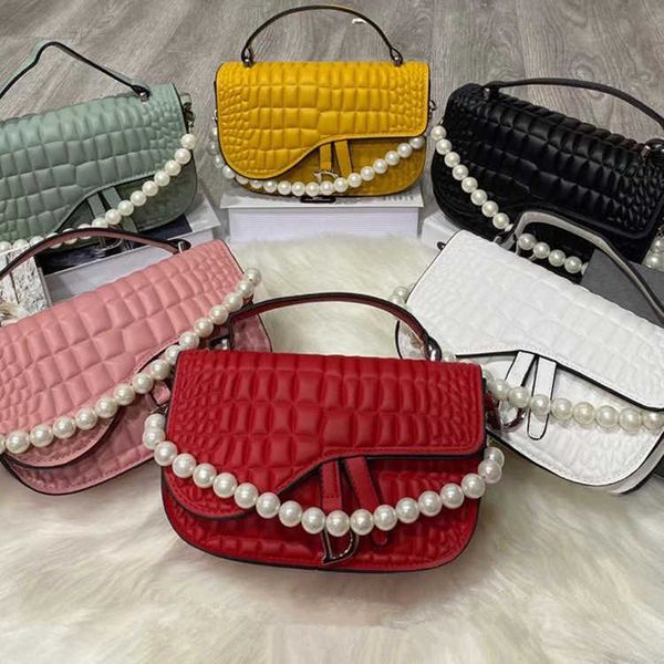2021 summer embossed foreign style saddle bag pearl chain hand single shoulder messenger women's trend fashion
2021 summer embossed foreign style saddle bag pearl chain hand single shoulder messenger women's trend fashion