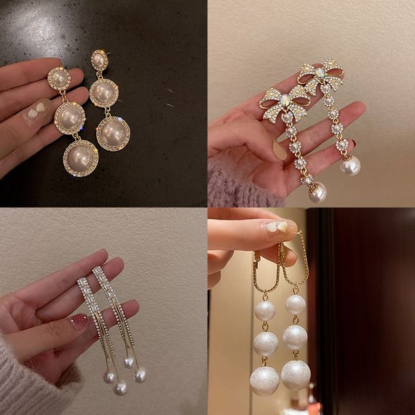 925 silver needle korean long pearl ear studs women's net red fashion design geometric earrings
925 silver needle korean long pearl ear studs women's net red fashion design geometric earrings