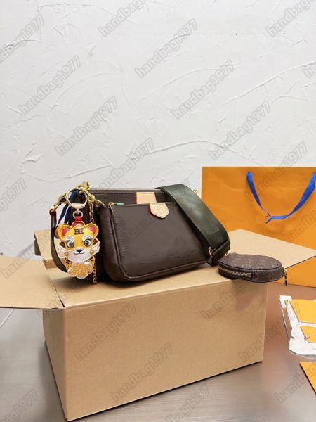 designer cross border shoulder bag l+ with tiger pendant three bags fashionable and universal leather for men and women of high quality
designer cross border shoulder bag l+ with tiger pendant three bags fashionable and universal leather for men and women of high quality