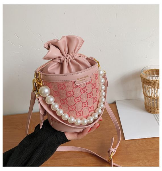 summer color contrast small fresh women's bag new fashion pearl messenger texture portable bucket
summer color contrast small fresh women's bag new fashion pearl messenger texture portable bucket