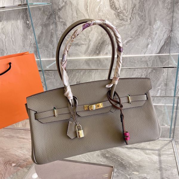 large capacity classic design leather handbag clemence soft shoulder bag noble temperament ladies with silk scarf handbags 42*23cm
large capacity classic design leather handbag clemence soft shoulder bag noble temperament ladies with silk scarf handbags 42*23cm