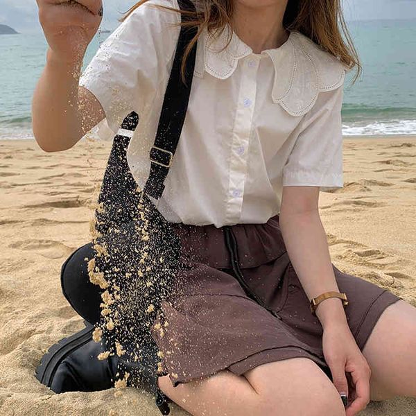 solid white causal loose turn down collar button line college wind preppy style women summer shirts 210522
solid white causal loose turn down collar button line college wind preppy style women summer shirts 210522