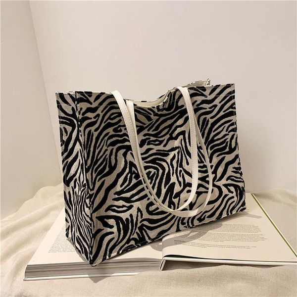 fashion simple zebra pattern bag female tote niche design large capacity for college students cross body
fashion simple zebra pattern bag female tote niche design large capacity for college students cross body