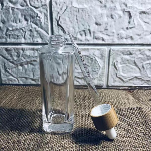 arrival 75ml flat clear shoulder square perfume essential oil glass bottle with bamboo cap empty bottles for cosmetic storage & jars
arrival 75ml flat clear shoulder square perfume essential oil glass bottle with bamboo cap empty bottles for cosmetic storage & jars