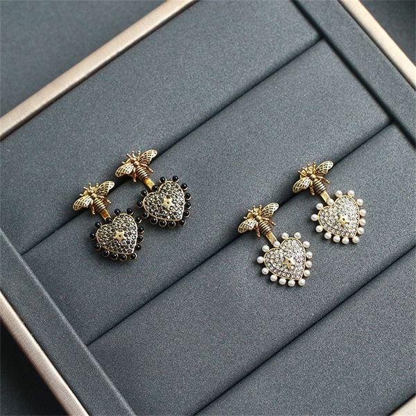 new brass studded female earrings with simple and butterfly heart-shaped, Black
new brass studded female earrings with simple and butterfly heart-shaped, Black