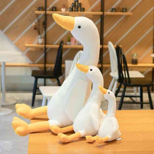 a creative new duck plush toy doll gives friends gifts in three colors 
a creative new duck plush toy doll gives friends gifts in three colors