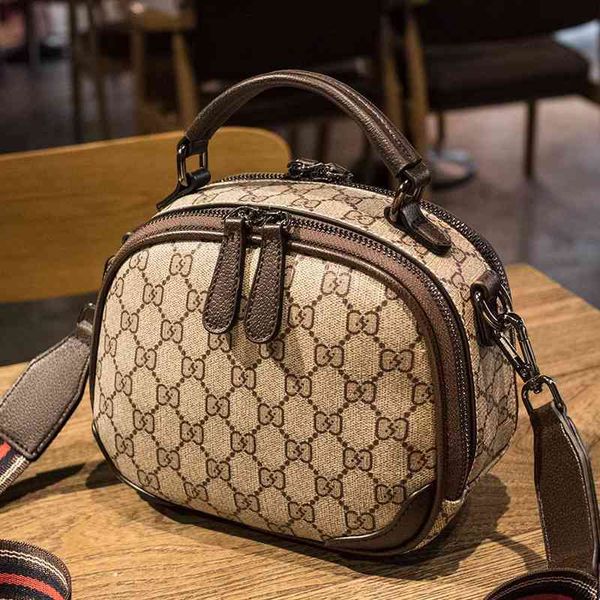 2022 new factory wholesale hani kezi one shoulder messenger cake women's printed small round bag trick
2022 new factory wholesale hani kezi one shoulder messenger cake women's printed small round bag trick
