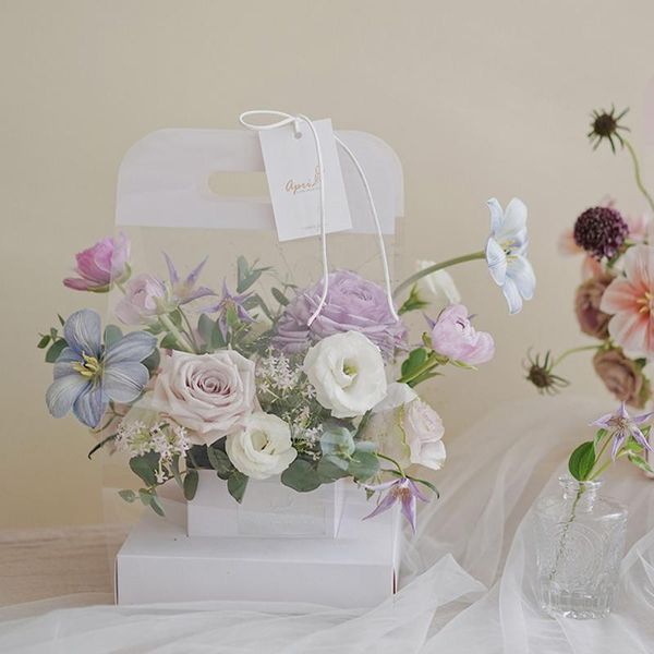 gift wrap transparent clear flower packaging bag with handle bouquet paper boxes for wedding valentine day
gift wrap transparent clear flower packaging bag with handle bouquet paper boxes for wedding valentine day