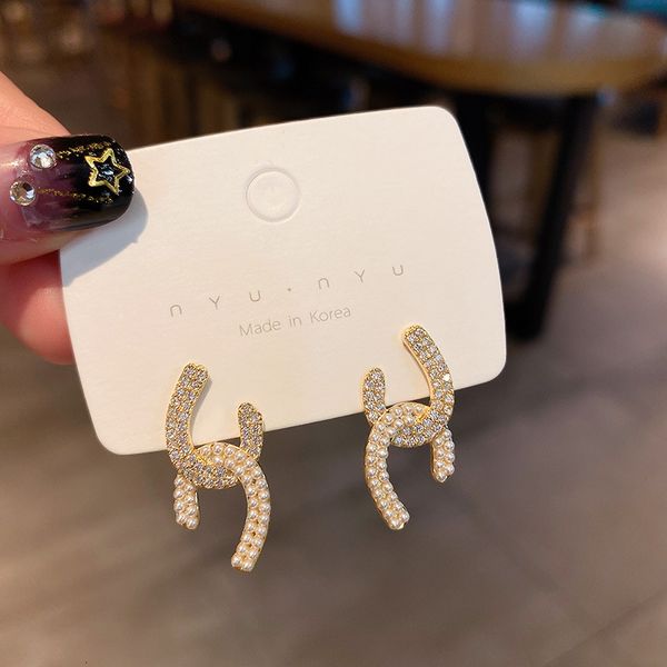 korean net red selling pearl diamond inlaid cross earrings 925 sier needle c-type small xiangfeng women's advanced sense, Golden
korean net red selling pearl diamond inlaid cross earrings 925 sier needle c-type small xiangfeng women's advanced sense, Golden