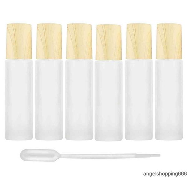 frosted clear glass roller bottles vials containers with metal roller ball and wood grain plastic cap for essential oil perfume 1
frosted clear glass roller bottles vials containers with metal roller ball and wood grain plastic cap for essential oil perfume 1